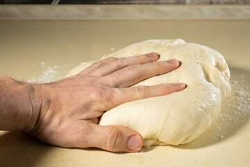 preparing the dough with your hands for baking
