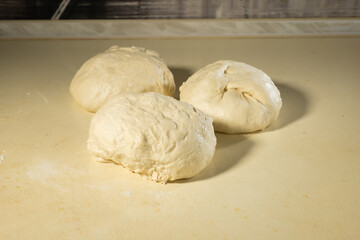 a piece of dough prepared for baking bread or cake