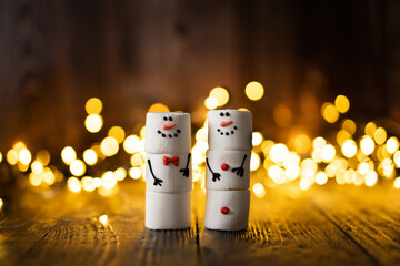 Marshmallow best friends. Two funny marshmallow snowmen. New year greeting card. Christmas winter...