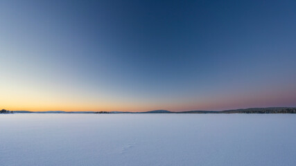 Lake Inari of Finnish Lapland in the middle of the winter. Even during the polar night when sun does not rise for a month, there is beautiful and abundant light.