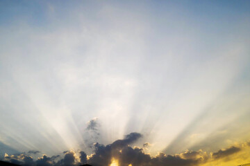 Fototapeta na wymiar Sun rays through the clouds