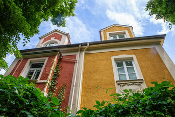 Germany, Bavaria, Munich, Red and yellow facade of old historic villa