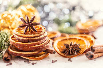 Fototapeta na wymiar Dried orange in the shape of a Christmas tree and star anise on top