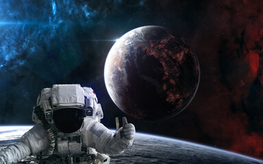 Obraz na płótnie Canvas Astronaut in outer space. Inhabited planet of deep space. Science fiction. Elements of this image furnished by NASA