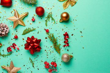 Christmas composition with decorations and ornaments on a mint background