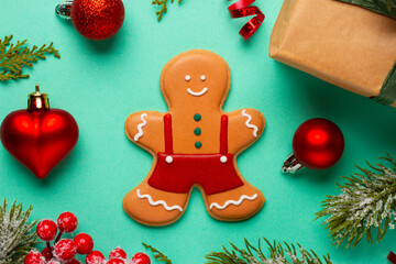 Christmas composition with decorations and ornaments on a mint background