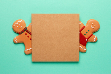 Christmas composition with decorations and cookies on a mint background with space for text