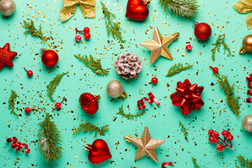 Christmas composition with decorations and ornaments on a mint background