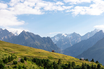 Fototapeta premium Amazing view from the Tskahazagari peak on the Svaneti mountain peaks near Mestia in the Greater Caucasus Mountain Range, Upper Svaneti,Country of Georgia.Hiking trail to the Koruldi Lakes.Cottage,hut