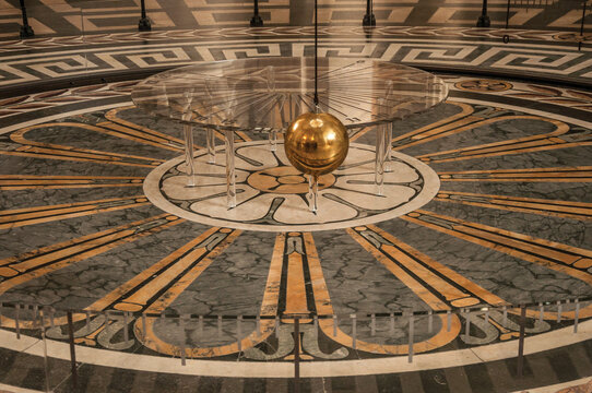 Paris, northern France - July 12, 2017. View of the famous Foucault Pendulum copper ball swinging inside the Pantheon in Paris. Known as one of the most impressive world’s cultural center.