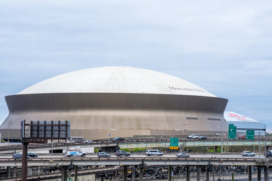 Superdome And Smoothie King Center In Background With Traffic On Interstate 10 In Foreground On March 19, 2021 In New Orleans, Louisiana, USA