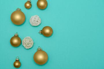 Green background with gold balls. New Year's decoration. Background. Christmas. Spruce.