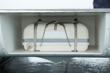 A commercial life raft onboard a fishing boat - the raft will deploy automatically if required. an automatic inflatable lifeboat ensures safety
