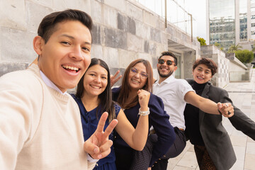 Coworkers leaving the office chatting together.
