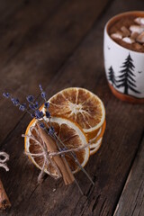 Fototapeta premium Cocoa with marshmallows, cinnamon and dried oranges