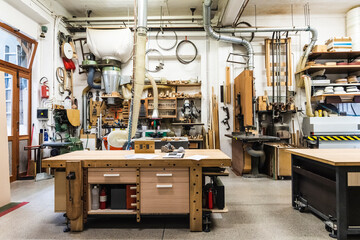 Wooden workbench in illuminated workshop