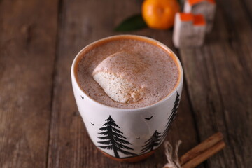 Cocoa with ice cream in a mug on a wooden background