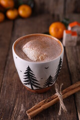 Cocoa with ice cream in a mug on a wooden background