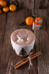 Cocoa with ice cream in a mug on a wooden background