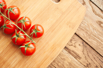 cherry tomatoes on a branch fresh food ingredients for salad