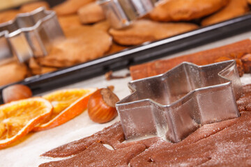 Dough, accessories with ingredients for baking gingerbread and fresh baked Christmas cookies