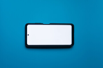 Mobile phone on blue background