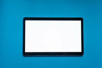Tablet on blue background