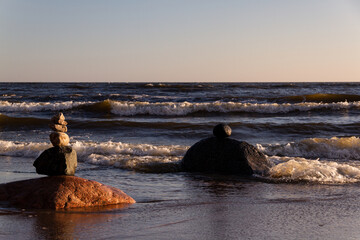 The rock in the surf.