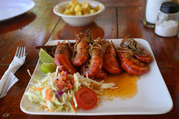 Family eats seafood on wooden table during weekend