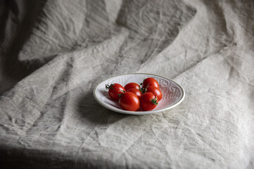 Cherry tomatoes on gray background