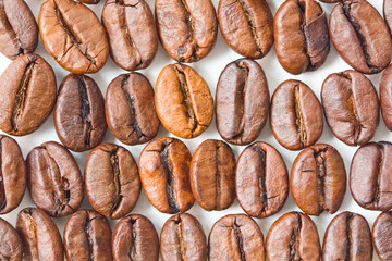 Close-up shot of some roasted coffee beans.