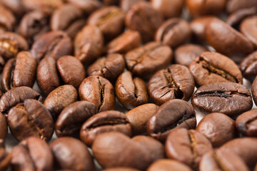 Close-up shot of some roasted coffee beans.