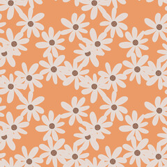 Fototapeta premium Doodle ditsy flowers seamless pattern on orange background. Retro chamomile print. Floral ornament.