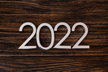 2022 New Year and Christmas celebration copy space. Composition with 2022 number on the wooden background