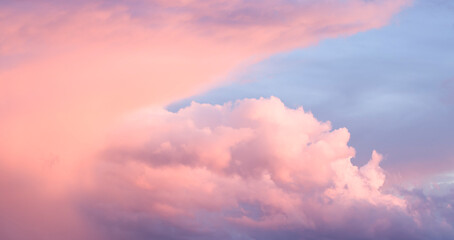 Moody sky with clouds at sunset, background