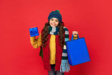 shopping child with purchase. kid with package. copy space. happy birthday holiday.