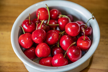 Selective focus closeup on a bowl of cherries