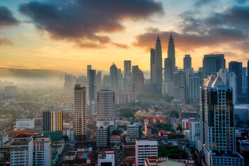 Cityscape of Kuala Lumpur city skyline at sunset in Malaysia.
