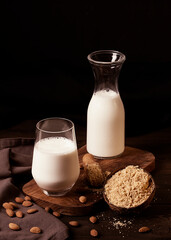 Almond milk and flour, on a wooden table, selective focus, vertical, no people,