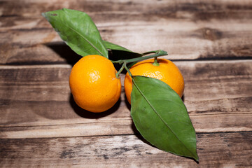 Mandarin.  mandarins lie on a wooden table.
