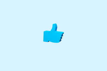 Thumb up icon from the color background. Concept of like at social network, success or good feedback. 3d rendering