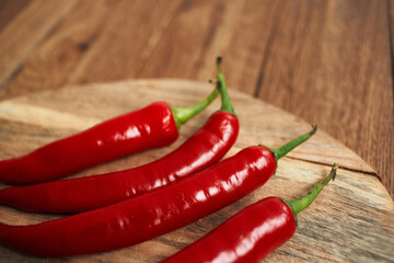 red hot chili peppers on a wooden board kitchen ingredients
