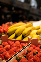 Strawberries and bananas in organic natural market in sustainable fair market