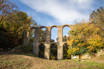 Ruins of Roman Aqueduct located in Ancient Monterano,Canale Monterano,Italy.With the great beauty among natural environment surrounding,still good preserves the traces of the past.View from front