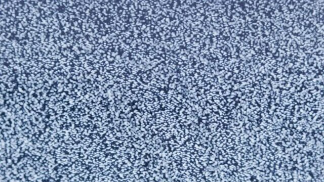distorted white noise interference on a small portable analog TV with a cathode ray tube 