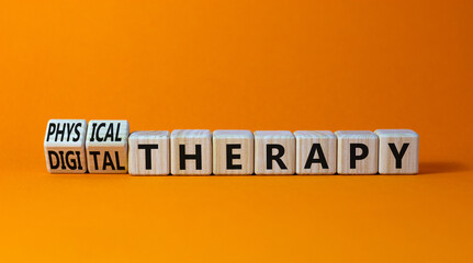 Physical or digital therapy symbol. Turned wooden cubes and changed words physical therapy to digital therapy. Beautiful orange background. Medical, physical or digital therapy concept. Copy space.