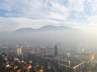 Aerial view of Sarajevo in the fog and the Trebević mountain