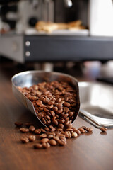 Arabica coffee beans have been roasted on a wooden table in the cafe kitchen
