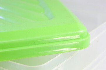 Plastic box with green lid and transparent box