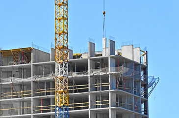 Crane and highrise construction site